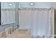 Bathroom with marble vanity, sleek mirror, and walk in shower at 704 N Main Ave, Newton, NC 28658
