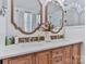 Bathroom with double sink vanity, wooden cabinets, white countertop and decor at 704 N Main Ave, Newton, NC 28658