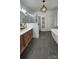 Modern bathroom with a glass shower, bathtub, and sleek fixtures at 704 N Main Ave, Newton, NC 28658