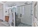 Modern tiled shower and vanity with double sinks in this spacious bathroom at 704 N Main Ave, Newton, NC 28658