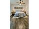 Comfortable bedroom features dark wood floors and natural light at 704 N Main Ave, Newton, NC 28658