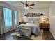 Cozy bedroom with rustic headboard, soft lighting, and hardwood floors at 704 N Main Ave, Newton, NC 28658