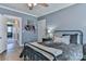 Bedroom with an open doorway showcasing a glimpse into an adjoining room, blending style and functionality at 704 N Main Ave, Newton, NC 28658