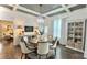 Bright dining room featuring a decorative chandelier, hardwood floors, and a built-in cabinet at 704 N Main Ave, Newton, NC 28658