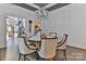 Bright dining area features hardwood flooring, chandelier and adjacent kitchen access at 704 N Main Ave, Newton, NC 28658