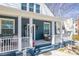 Charming front porch showcasing a cozy seating area and decorative touches adding to the home's appeal at 704 N Main Ave, Newton, NC 28658