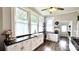 Kitchen features a farm sink, black countertops, and lots of natural light at 704 N Main Ave, Newton, NC 28658