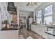 Well-lit kitchen featuring modern appliances, granite countertops, and a farmhouse sink at 704 N Main Ave, Newton, NC 28658