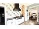 Chef's kitchen with granite countertops, stainless steel appliances and adjacent dining room at 704 N Main Ave, Newton, NC 28658