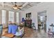 Cozy living room featuring a fireplace, hardwood floors, and an inviting atmosphere with dining room view at 704 N Main Ave, Newton, NC 28658