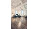 Spacious living room features a coffered ceiling, hardwood floors, and lots of natural light at 704 N Main Ave, Newton, NC 28658