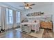 Calming main bedroom featuring warm lighting, a ceiling fan, and decorative accents at 704 N Main Ave, Newton, NC 28658
