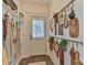 Functional mud room with hooks, shelving, and an organized display of cutting boards at 704 N Main Ave, Newton, NC 28658