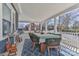 A cozy front porch offers a dining area and beautiful outdoor space at 704 N Main Ave, Newton, NC 28658
