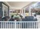 This cozy front porch offers a dining area and a Traeger grill at 704 N Main Ave, Newton, NC 28658
