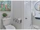 Modern bathroom features a toilet and black iron sink with decorative accents at 704 N Main Ave, Newton, NC 28658