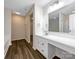 Bathroom featuring large mirror, ample vanity space, and wood-look flooring at 722 Ladino Ln, Clover, SC 29710