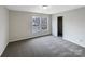 Neutral bedroom with large windows and plush carpet at 722 Ladino Ln, Clover, SC 29710