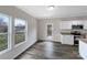 Bright dining area with large windows and access to a modern kitchen at 722 Ladino Ln, Clover, SC 29710