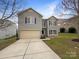 Two-story home featuring blue shutters, vinyl siding, and attached garage at 722 Ladino Ln, Clover, SC 29710
