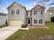 Charming two-story home with blue shutters and vinyl siding at 722 Ladino Ln, Clover, SC 29710