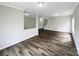 Bright, open living area featuring stylish wood-look flooring and natural light at 722 Ladino Ln, Clover, SC 29710