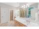 Bright bathroom featuring double sinks, a soaking tub, and a separate shower at 727 Mayfield Ct, Fort Mill, SC 29715