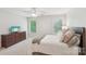 Spacious bedroom featuring two large windows, soft carpeting, a bed, and a dresser with a TV at 727 Mayfield Ct, Fort Mill, SC 29715