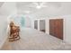 Spacious bonus room features plush carpet, bright lighting, and ample room for relaxation or entertainment at 727 Mayfield Ct, Fort Mill, SC 29715