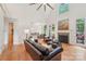Spacious living room with a fireplace, hardwood floors, comfortable seating, and an open layout at 727 Mayfield Ct, Fort Mill, SC 29715