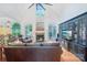 Bright living room with vaulted ceilings, hardwood floors, a fireplace, and a large entertainment center at 727 Mayfield Ct, Fort Mill, SC 29715