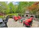 Inviting outdoor patio with stone fireplace and ample seating, perfect for entertaining or relaxing at 727 Mayfield Ct, Fort Mill, SC 29715