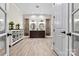 Luxurious bathroom with double vanities, stone accents, and elegant fixtures at 7509 Webbs Chapel Cove Ct, Denver, NC 28037