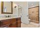 Well-lit bathroom featuring a granite vanity, shower, and tile flooring at 7509 Webbs Chapel Cove Ct, Denver, NC 28037