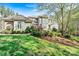 Stunning home with manicured lawn and mature trees providing shade and curb appeal at 7509 Webbs Chapel Cove Ct, Denver, NC 28037