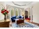 Bright living room with large arched windows, natural light, and a cozy seating area at 7509 Webbs Chapel Cove Ct, Denver, NC 28037