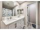 Bright bathroom with double sink vanity, large mirror, and a shower featuring a stylish blue curtain at 810 Rock Lake Gln, Fort Mill, SC 29715