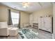 Charming Bedroom with a chair, changing table, and a soft, playful rug, creating a cozy space at 810 Rock Lake Gln, Fort Mill, SC 29715