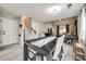 Open-concept dining area with modern table set, connecting to the living room and featuring access to the front door at 810 Rock Lake Gln, Fort Mill, SC 29715
