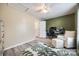Another view of office space with neutral walls and a chair, and a soft, playful rug, creating a cozy space at 810 Rock Lake Gln, Fort Mill, SC 29715