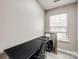 Bright office space with a desk and natural light streaming through the window for productivity at 810 Rock Lake Gln, Fort Mill, SC 29715