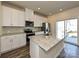 Bright kitchen with granite countertops, stainless appliances, and an island with a sink at 836 Blue Canyon Dr, York, SC 29745