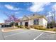 Well-maintained building exterior with neat landscaping, parking lot and attractive architectural details at 8457 Loxton Cir, Charlotte, NC 28214