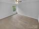 A simple bedroom features neutral carpet, a window with a natural outdoor view and light colored walls at 9037 Pembroke Ct, Fort Mill, SC 29707