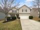 Charming two-story home with a well-maintained front yard and a two-car garage at 9037 Pembroke Ct, Fort Mill, SC 29707