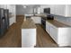 Modern kitchen featuring white cabinetry, granite countertops, and stainless steel appliances at 9037 Pembroke Ct, Fort Mill, SC 29707