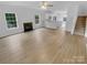 Inviting open concept living room featuring a fireplace, windows, and seamless access to the kitchen at 9037 Pembroke Ct, Fort Mill, SC 29707