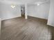 Open living space with modern lighting, neutral walls and wood look floors at 9037 Pembroke Ct, Fort Mill, SC 29707