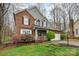 Attractive two-story home with brick accents, a covered porch, and a convenient two-car garage at 9238 Heritage Woods Pl, Charlotte, NC 28269