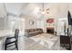 Inviting living room with vaulted ceilings, a cozy fireplace, and large windows for natural light at 9238 Heritage Woods Pl, Charlotte, NC 28269